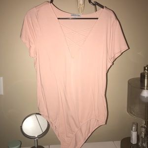 Charlotte Russe Tops - NWOT Peach pink bodysuit Charlotte Russe Tops - NWOT Peach pink bodysuit